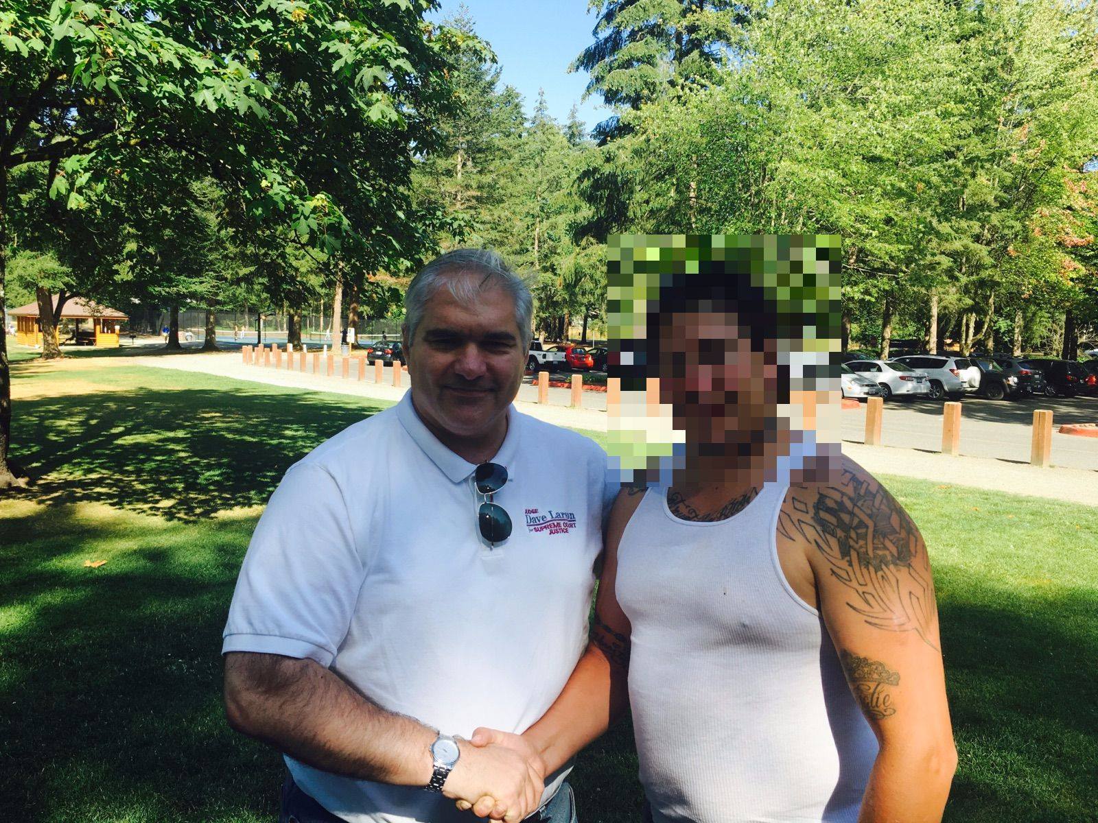 Judge Dave Larson reuniting with individuals from a past court case